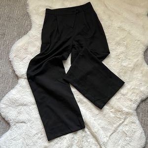 Black asymmetrical wide leg slacks